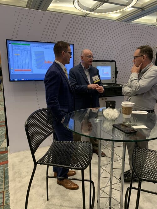 Ken Anderson, USC President & CEO, and Dale Hensley, Lockheed Martin IFD Lead, discuss IFD technology with a partner at an ASNE Conference in 2019.