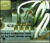 Broken connector held on by heat shrink wrap
