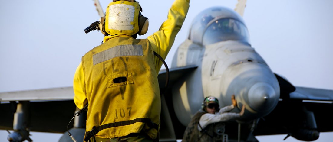 F-18 Hornet And Sailors